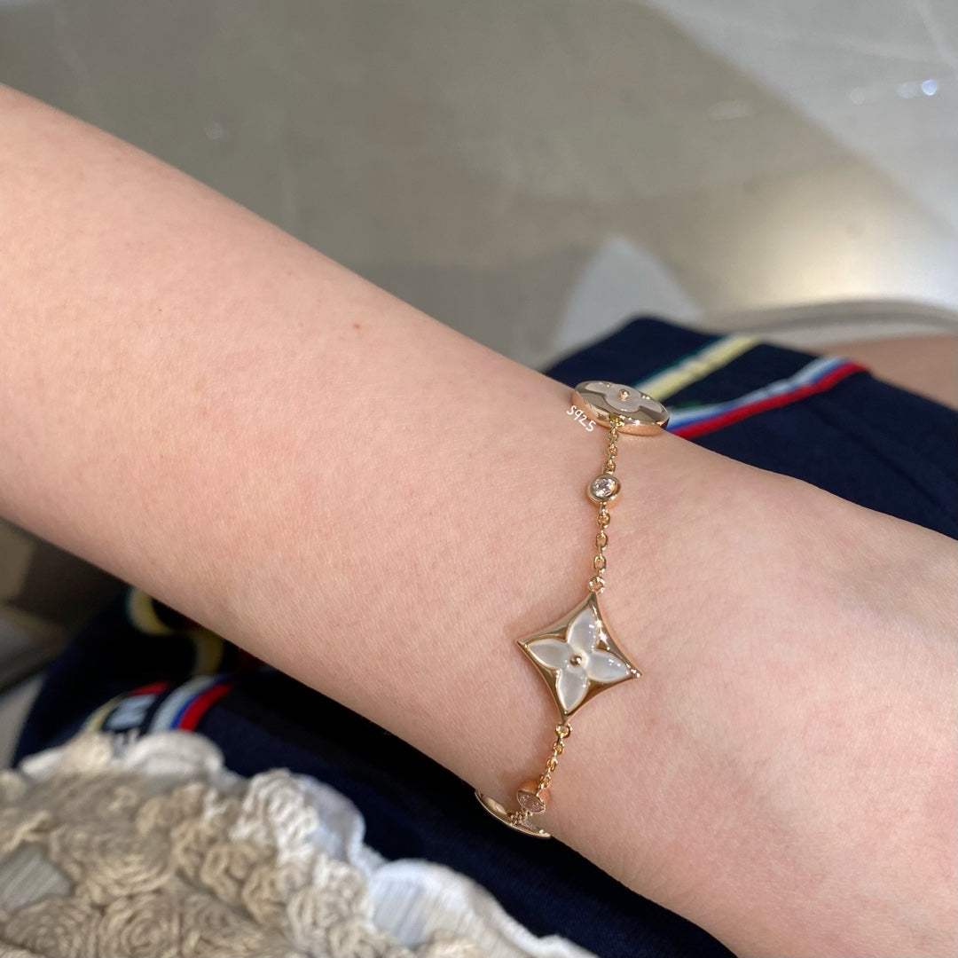 [KELA]STAR AND SUN 4 MOTIF WHITE MOP ROSE GOLD BRACELET